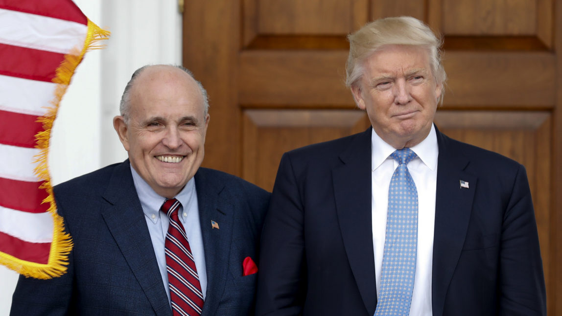 President-elect Donald Trump, right, and former New York Mayor Rudy Giuliani pose for photographs as Giuliani arrives at the Trump National Golf Club Bedminster clubhouse, Sunday, Nov. 20, 2016, in Bedminster, N.J.. (AP Photo/Carolyn Kaster)