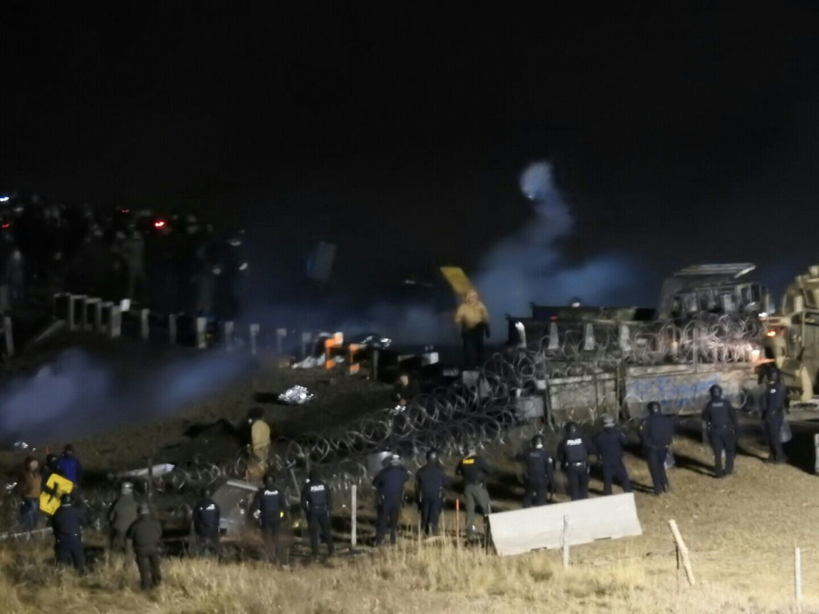 In this image provided by Morton County Sheriff’s Department, law enforcement and protesters clash near the site of the Dakota Access pipeline on Sunday, Nov. 20, 2016, in Cannon Ball, N.D. (Morton County Sheriff’s Department via AP)