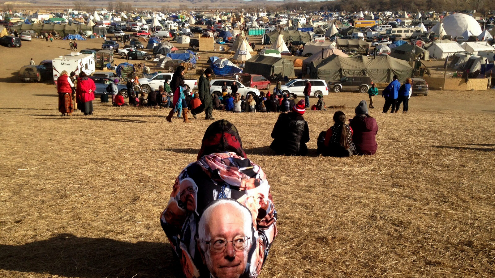 Protesters gather at an encampment on Saturday, Nov. 26, 2016, a day after tribal leaders received a letter from the U.S. Army Corps of Engineers that told them the federal land would be closed to the public on Dec. 5, near Cannon Ball, N.D. The protesters said Saturday that they do not plan to leave and will continue to oppose construction of the Dakota Access oil pipeline. (AP photo/James MacPherson)