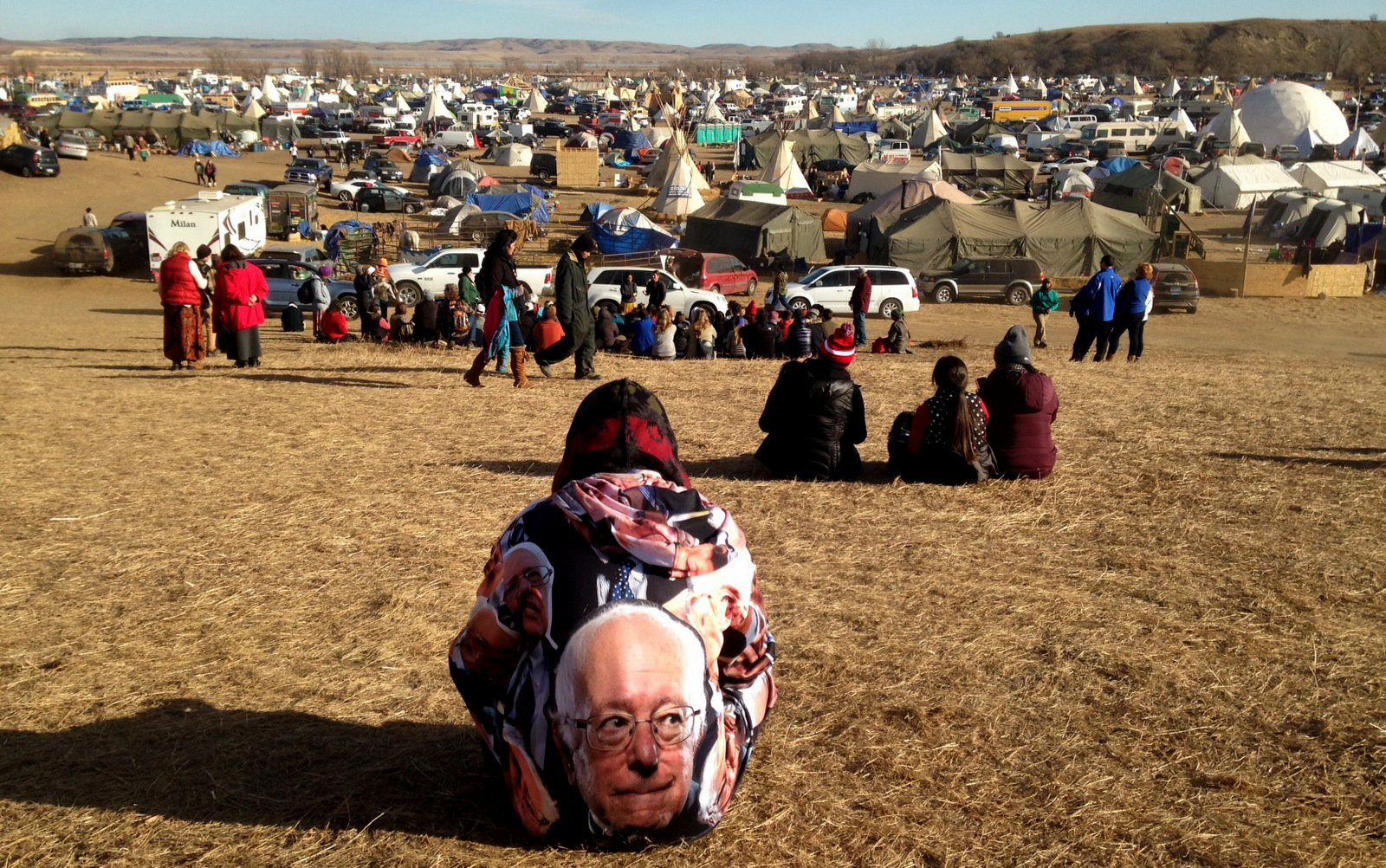 Protesters gather at an encampment on Saturday, Nov. 26, 2016, a day after tribal leaders received a letter from the U.S. Army Corps of Engineers that told them the federal land would be closed to the public on Dec. 5, near Cannon Ball, N.D. The protesters said Saturday that they do not plan to leave and will continue to oppose construction of the Dakota Access oil pipeline. (AP photo/James MacPherson)