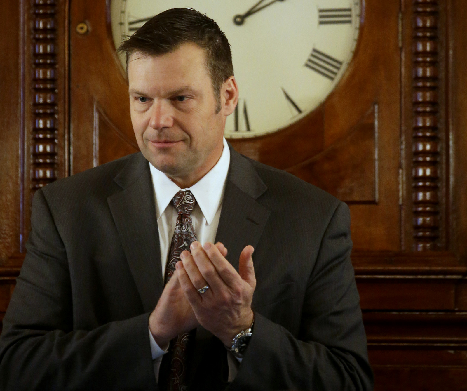 In this Monday, Jan. 12, 2015 photo, Kansas Secretary of State Kris Kobach presides over the Kansas House while new members are sworn in during the opening day of the Kansas legislature in Topeka, Kan. (AP Photo/Charlie Riedel, File)