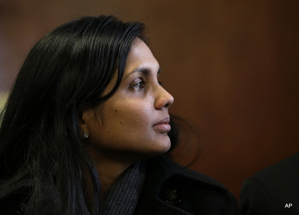 Annie Dookhan sits in Suffolk Superior Court moments before her arraignment in Boston, Thursday, Dec. 20, 2012. Dookhan, the former chemist at the center of a U.S. drug testing scandal, pleaded not guilty to charges including perjury and tampering with evidence.