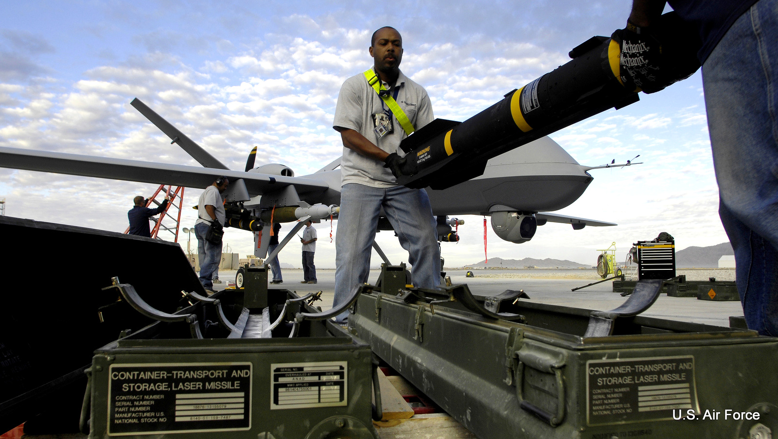Photo of Hellfire missiles being loaded onto a US military Reaper drone in Afghanistan by Staff Sgt. Brian Ferguson/U.S. Air Force