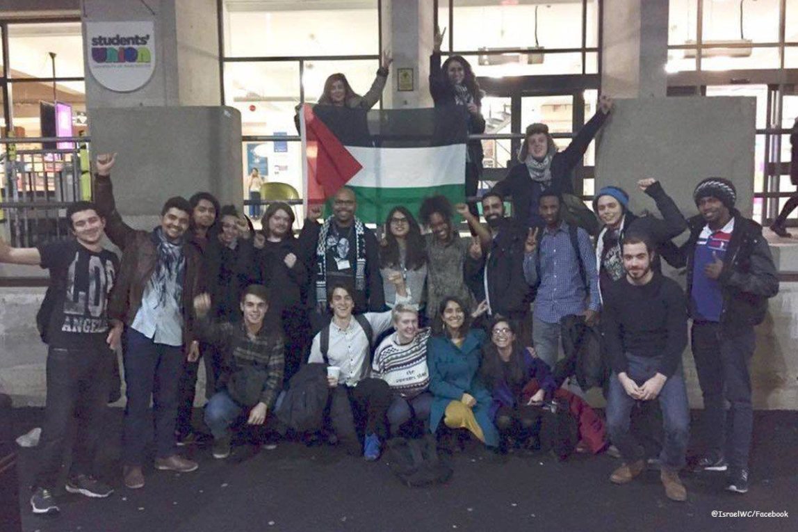 Image of students celebrating after the University of Manchester’s Student Union Senate voted to pass a motion in support of BDS on 11th December 2016 [@IsraelWC/Facebook]