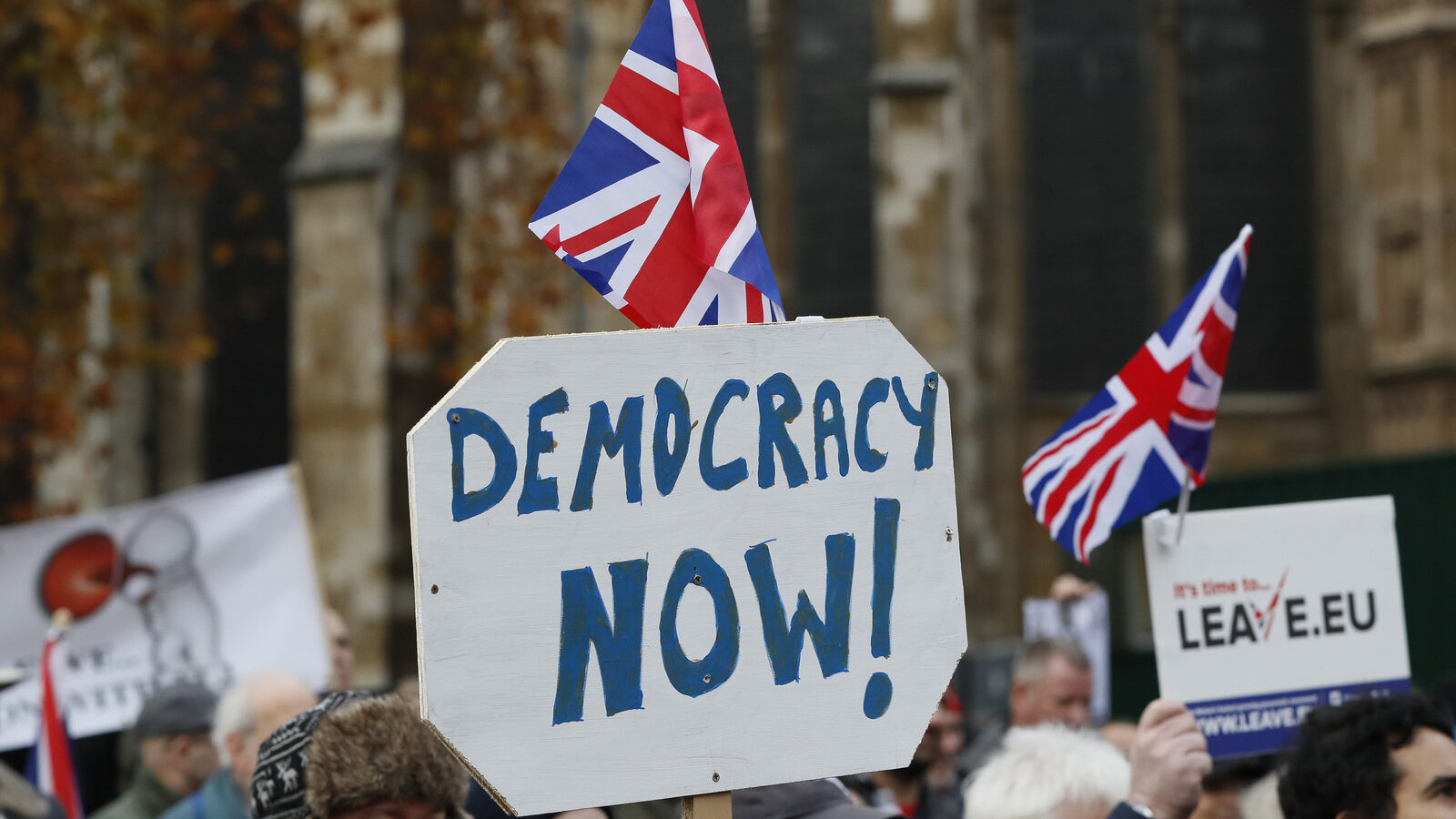 Pro-Brexit demonstrators wave flags and banners outside Parliament in London, Wednesday, Nov. 23, 2016. (AP/Kirsty Wigglesworth)