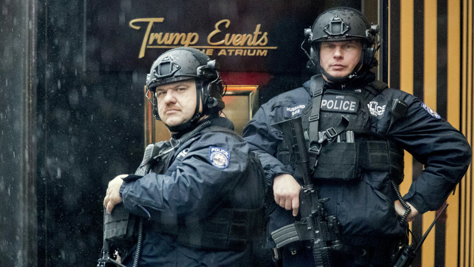 Heavily armed police officers stand guard in the rain outside Trump Tower, Tuesday, Nov. 29, 2016, in New York. (AP Photo/Mary Altaffer)