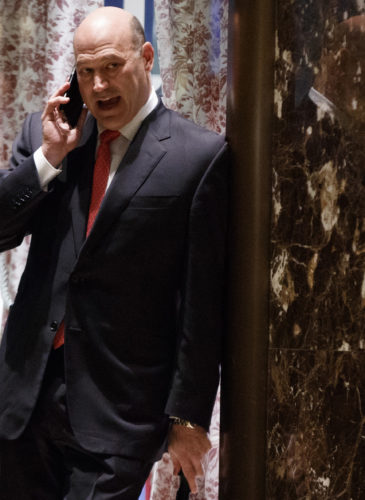 Goldman Sachs COO Gary Cohn talks on the phone as he waits for the start of a meeting with President-elect Donald Trump at Trump Tower, Tuesday, Nov. 29, 2016, in New York. (AP Photo/Evan Vucci)