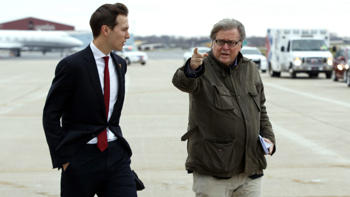 Jared Kushner, son in-law of President-elect Donald Trump, left, walks with Trump's Chief Strategist Stephen Bannon at Indianapolis International Airport, Thursday, Dec. 1, 2016, in Indianapolis, Ind. (AP Photo/Evan Vucci)