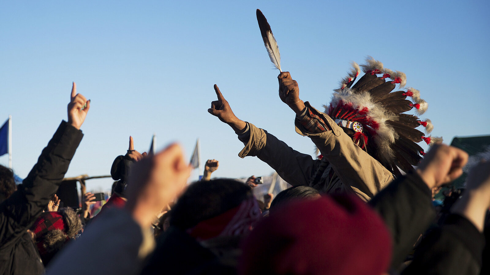 A crowd gathers in celebration at the Oceti Sakowin camp after it was announced that the U.S. Army Corps of Engineers won't grant easement for the Dakota Access oil pipeline in Cannon Ball, N.D., Sunday, Dec. 4, 2016. (AP Photo/David Goldman)