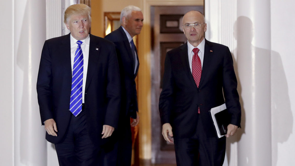 In this Nov. 19, 2016 file photo, President-elect Donald Trump walks with CKE Restaurants CEO Andy Puzder from Trump National Golf Club Bedminster clubhouse in Bedminster, N.J. (AP Photo/Carolyn Kaster)