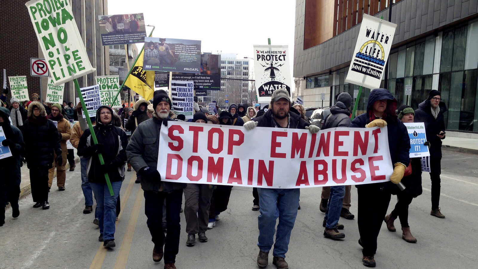 Dakota Access pipeline protesters march from the Polk County Courthouse to a public meeting space to hold a rally Dec. 15, 2016 in Des Moines, Iowa. The protests came after a judge heard arguments in a lawsuit filed by several Iowa landowners who challenge forceful taking of their land for the pipeline and challenge the state's permit process. (AP Photo/David Pitt)