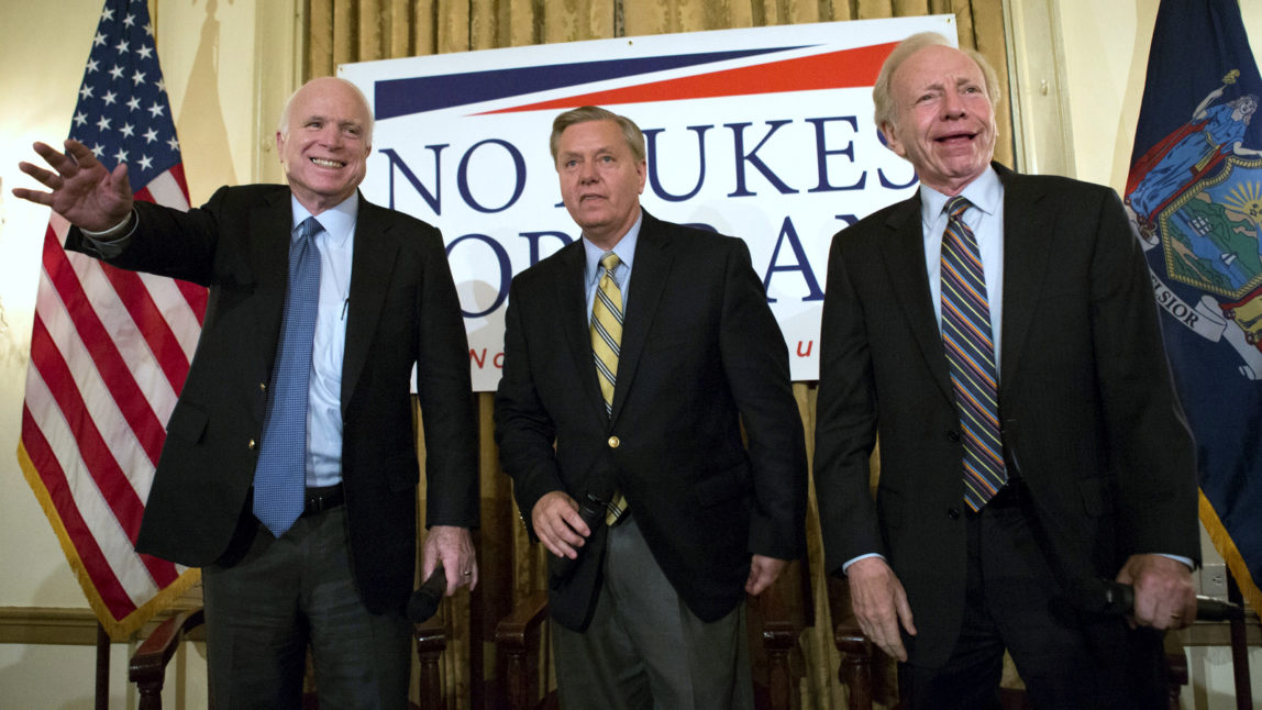 Sen. John McCain, R-Ariz., left, Republican presidential candidate Sen. Lindsey Graham, center and former Sen. Joe Lieberman, I-Conn., right, arrive on stage at a town hall meeting at the 3 West Club to launch Graham's “No Nukes for Iran” tour Monday, July 20, 2015, in New York. (AP Photo/Kevin Hagen)