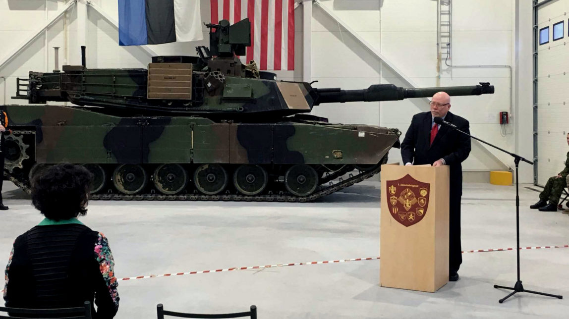 U.S. Ambassador to Estonia James D. Melville Jr. addresses dignitaries in front of an U.S. Army tank, at a hand-over ceremony of the upgraded NATO military base in Tapa, Estonia, Thursday, Dec. 15, 2016. The