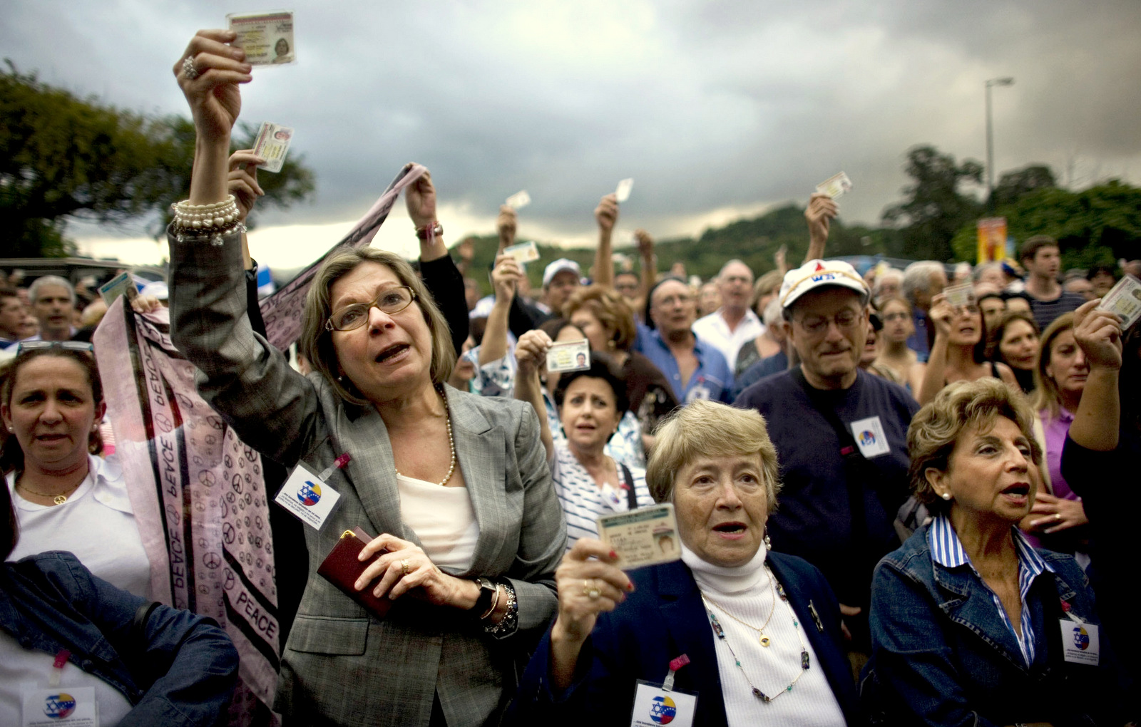  In this Feb. 2009 photo, Venezuelans hold up their ID cards during a protest against anti-semitism outside a synagogue in Caracas, Venezuela following outrage at the 2009 Israeli war on the Gaza Strip. (AP/Ariana Cubillos)