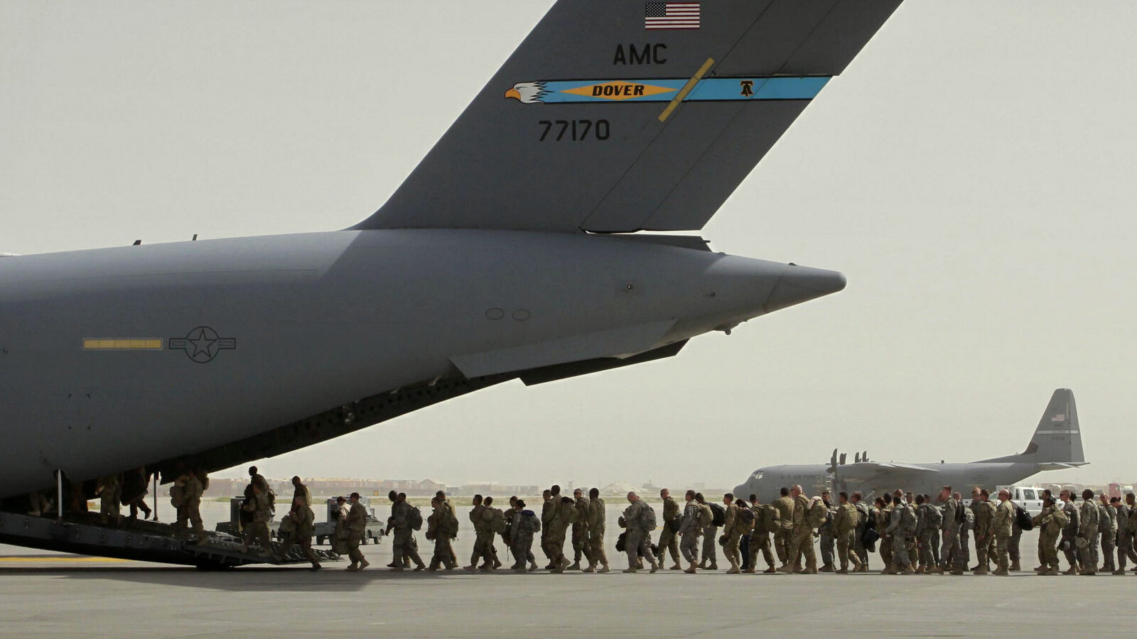 U.S. soldiers board a U.S. military aircraft in Bagram, north of Kabul, Afghanistan. (AP/Musadeq Sadeq)
