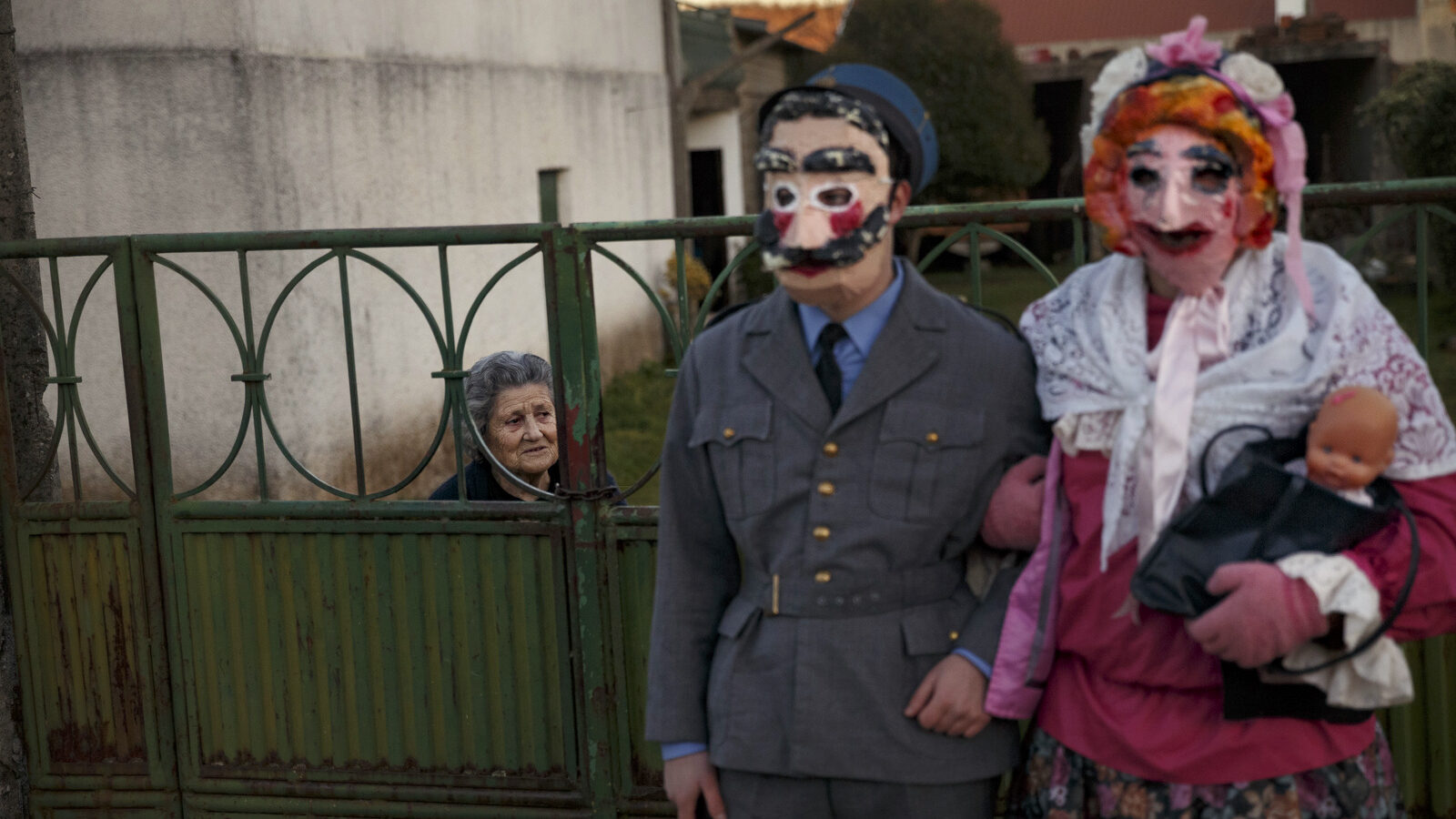 In this photo taken on Saturday, Jan. 7, 2017, a couple dressed as characters from 'la Vaquilla' wearing ancient masks pose for a photo, during a winter masquerade gathering in Salsas, Portugal. Many of these masquerades are of ancient origin and can often be traced to pre-Christian Celtic and often pre-Roman traditions around the renewal of fertility and life and an end of winter. (AP/Daniel Ochoa de Olza)