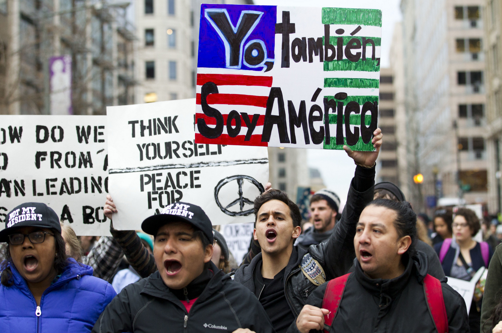 Demonstrators march on the street near a security checkpoint inaugural entrance, Friday, Jan. 20, 2017 in Washington, ahead of President-elect Donald Trump's inauguration. (AP/Jose Luis Magana)