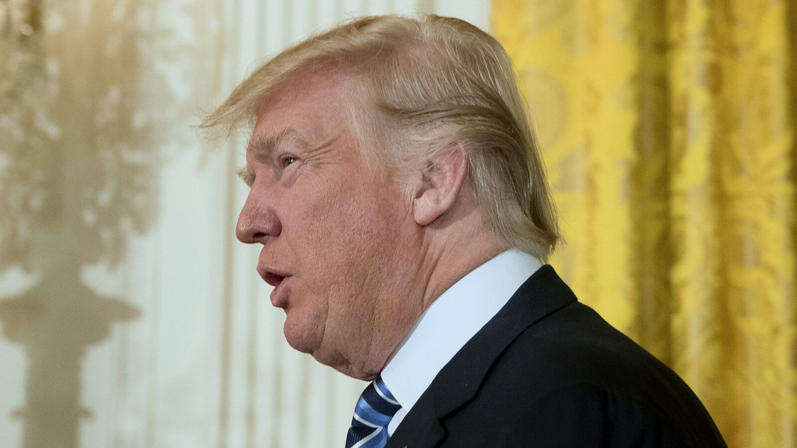President Donald Trump arrives for a White House senior staff swearing in ceremony in the East Room of the White House, Sunday, Jan. 22, 2017, in Washington. (AP/Andrew Harnik)