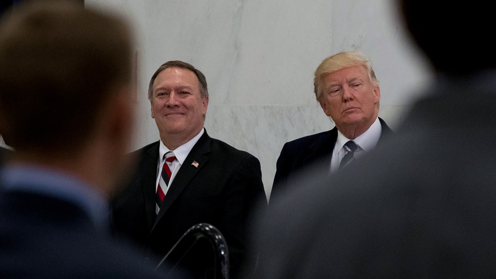 President Donald Trump, accompanied by CIA Director-designate Rep. Michael Pompeo, left, waits to speak at the Central Intelligence Agency in Langley, Va., Saturday, Jan. 21, 2017. (AP/Andrew Harnik)