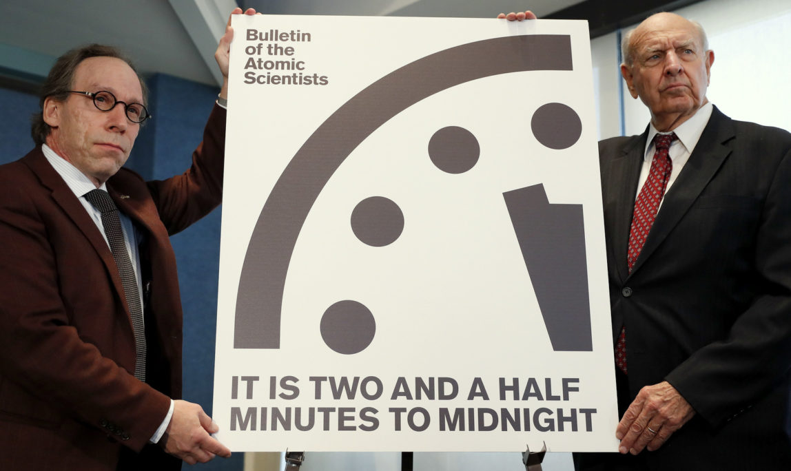Lawrence Krauss, theoretical physicist, chair of the Bulletin of the Atomic Scientists Board of Sponsors, left, and Thomas Pickering, co-chair of the International Crisis Group, display the Doomsday Clock during a news conference the at the National Press Club in Washington, Thursday, Jan. 26, 2017, announcing that the Bulletin of the Atomic Scientist have moved the minute hand of the Doomsday Clock to two and a half minutes to midnight. (AP Photo/Carolyn Kaster)
