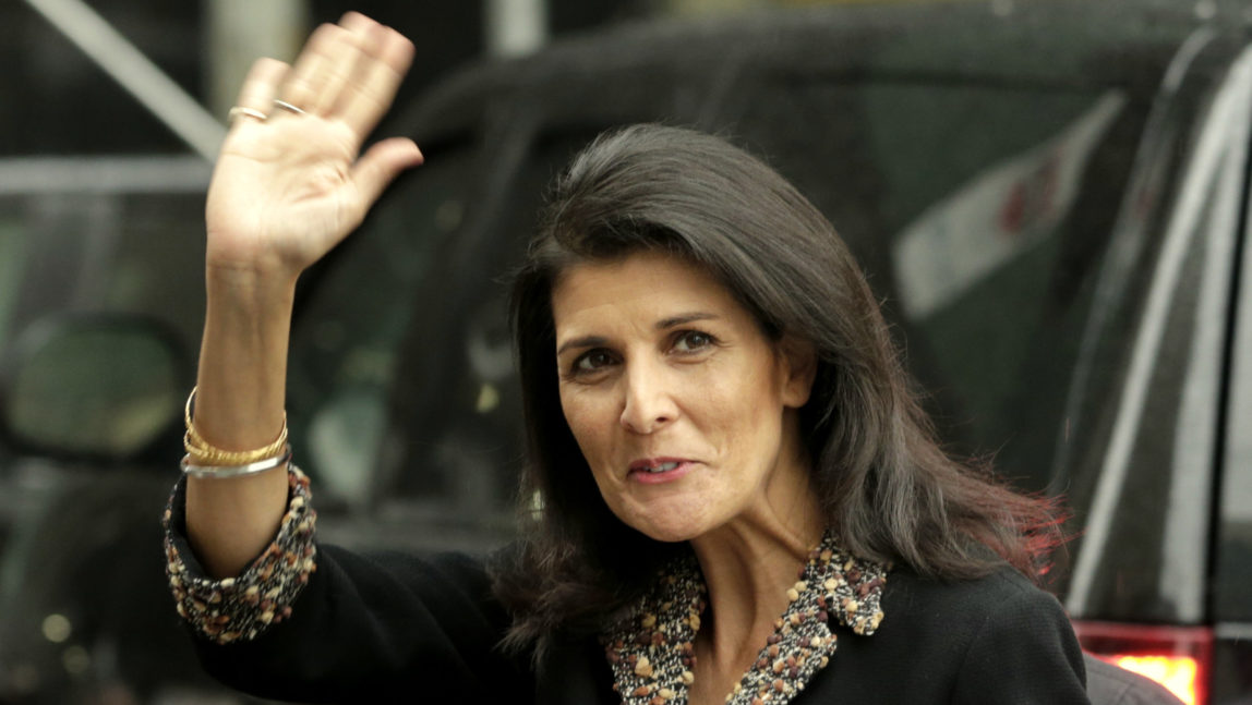 The new United States Ambassador to the United Nations Nikki Haley waves to reporters as she arrives to the home of the U.S. Mission in New York, Thursday, Jan. 26, 2017. (AP/Seth Wenig)