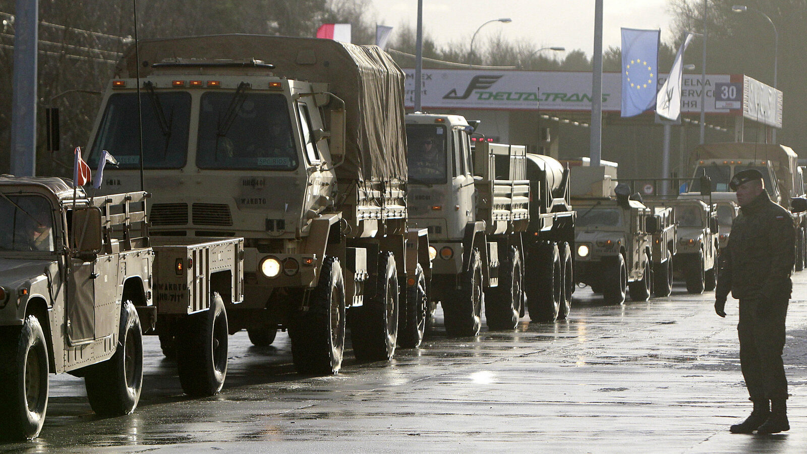 U.S. Army vehicles cross the Polish border in Olszyna, Poland, Thursday, Jan. 12, 2017 heading for their new base in Zagan. (AP/Czarek Sokolowski)