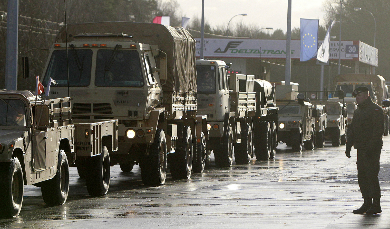 U.S. Army vehicles cross the Polish border in Olszyna, Poland, Thursday, Jan. 12, 2017 heading for their new base in Zagan. (AP/Czarek Sokolowski)