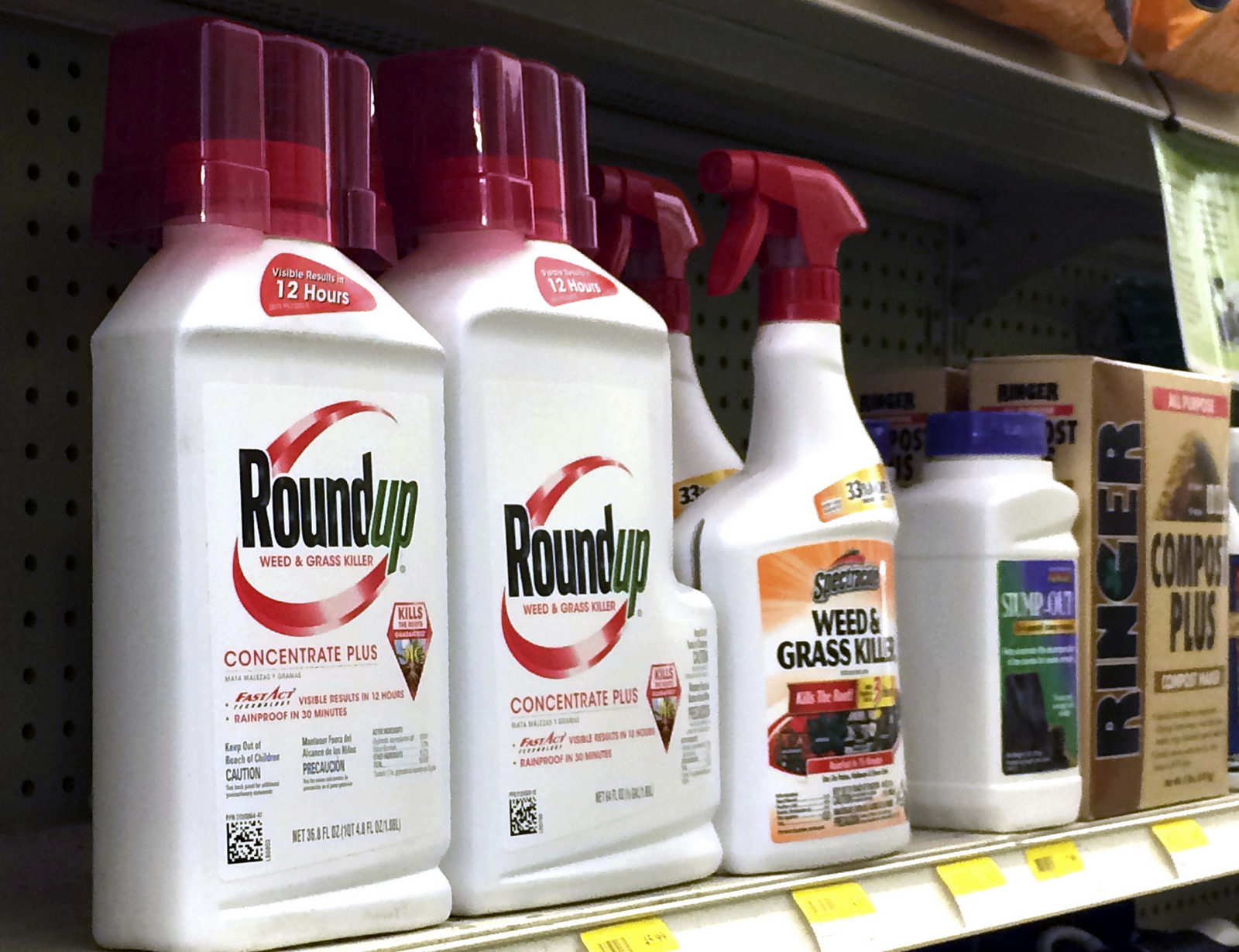 Containers of Roundup, left, a weed killer is seen on a shelf with other products for sale at a hardware store in Los Angeles on Thursday, Jan. 26, 2017.   (AP/Reed Saxon)