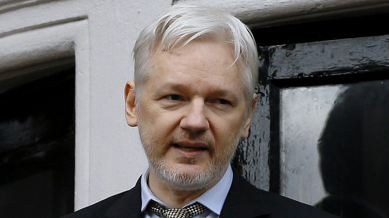 Wikileaks founder Julian Assange speaks from the balcony of the Ecuadorean Embassy in London. (AP/Kirsty Wigglesworth)