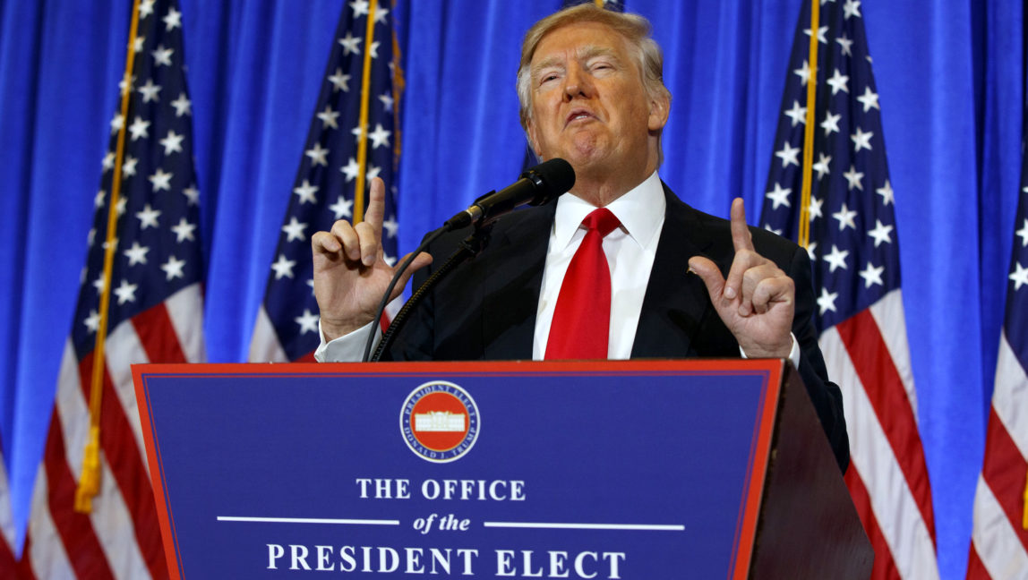 In this Jan. 11, 2017, photo, Donald Trump speaks during a news conference in the lobby of Trump Tower in New York. The incoming president staged a defiant and frenetic news conference at his gilded New York City tower, dismissing critics, insulting reporters and likening the country’s intelligence officers to Nazis. (AP Photo/Evan Vucci)
