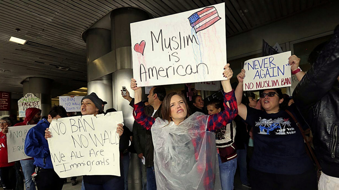 Protesters rally against President Trump's refugee ban at Miami International Airport on Sunday, Jan. 29, 2017.President Donald Trump’s immigration order sowed more confusion and outrage across the country Sunday, with travelers detained at airports, panicked families searching for relatives and protesters registering their opposition to the sweeping measure. (C.M. Guerrero/El Nuevo Herald via AP)