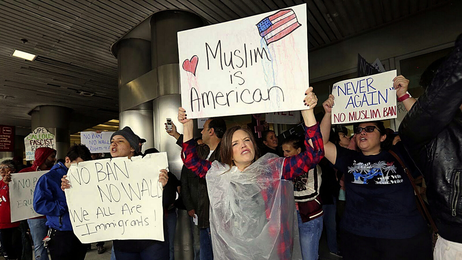 Protesters rally against President Trump's refugee ban at Miami International Airport on Sunday, Jan. 29, 2017.President Donald Trump’s immigration order sowed more confusion and outrage across the country Sunday, with travelers detained at airports, panicked families searching for relatives and protesters registering their opposition to the sweeping measure. (C.M. Guerrero/El Nuevo Herald via AP)