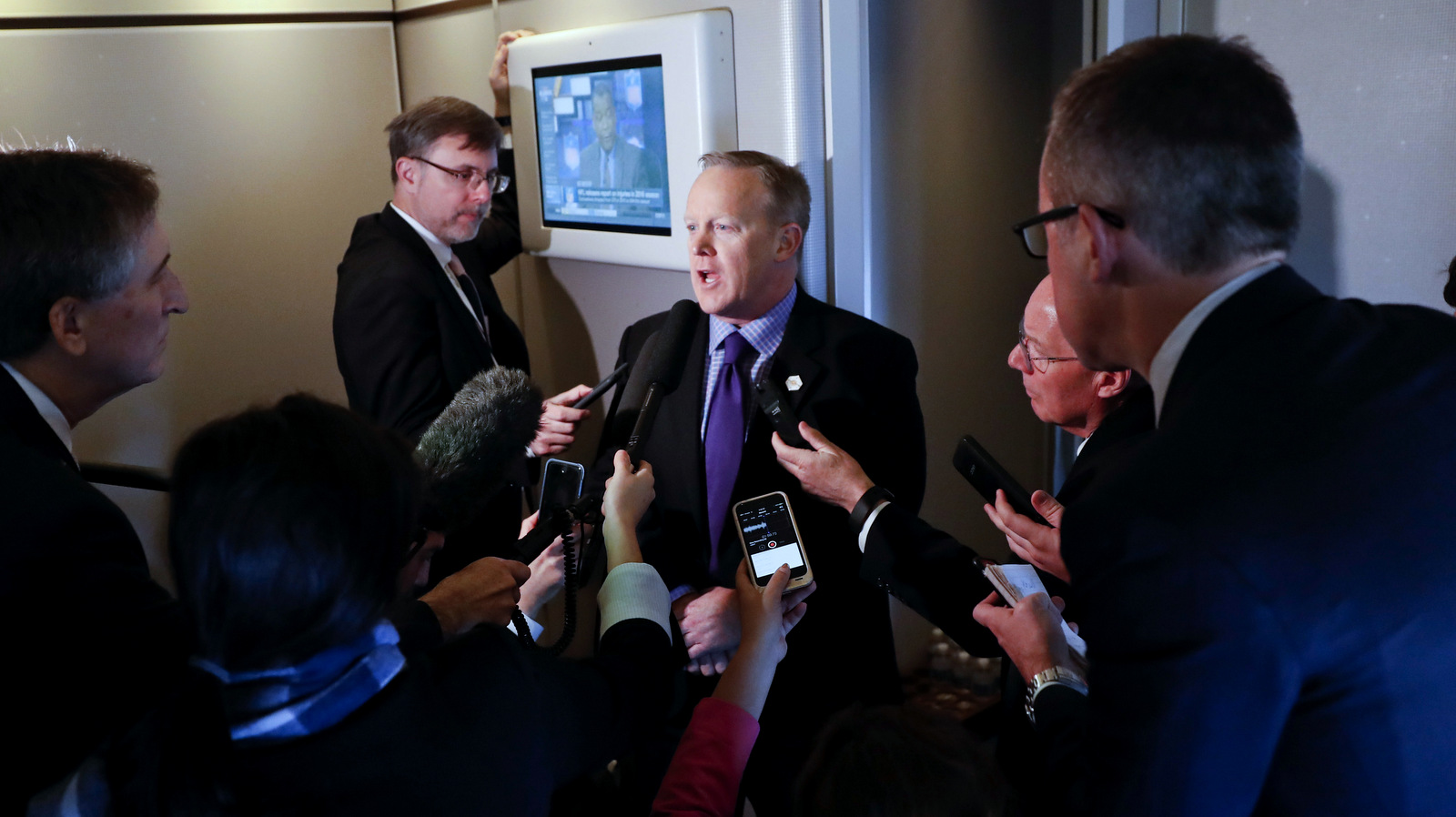 White House press secretary Sean Spicer speaks to reporters on Air Force One en route to Andrews Air Force Base, Thursday, Jan. 26, 2017, from Philadelphia. (AP /Pablo Martinez Monsivais)