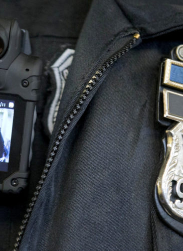 A Philadelphia police officer demonstrates a body-worn camera used as part of a pilot project in Philadelphia. (AP/Matt Rourke)