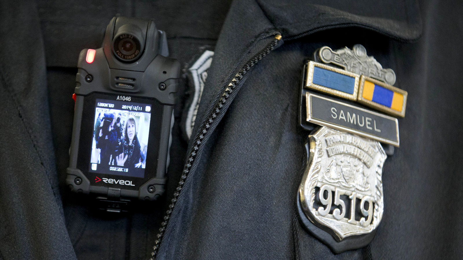 A Philadelphia police officer demonstrates a body-worn camera used as part of a pilot project in Philadelphia. (AP/Matt Rourke)