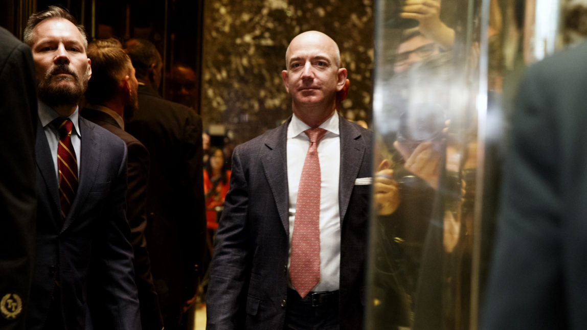 Amazon founder and Washington Post CEO Jeff Bezos gets on an elevator for a meeting between President-elect Donald Trump and technology industry leaders at Trump Tower in New York, Wednesday, Dec. 14, 2016. (AP/Evan Vucci)