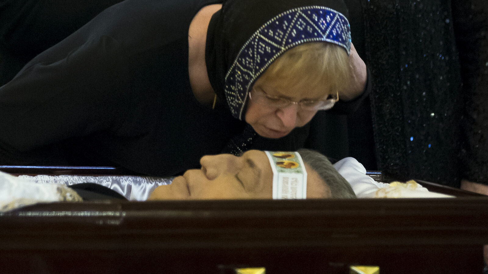 The widow of Andrei Karlov Marina kisses her husband during a religious service for killed Russian ambassador to Turkey, Andrei Karlov inside the Christ the Saviour Cathedral in Moscow, Russia, Thursday, Dec. 22, 2016.(AP/Alexander Zemlianichenko)