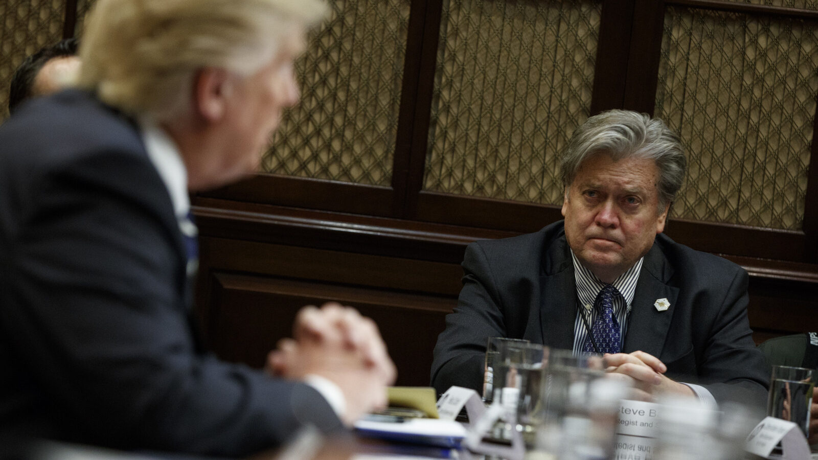 White House Chief Strategist Steve Bannon listens as President Donald Trump speaks in the Roosevelt Room of the White House in Washington, Tuesday, Jan. 31, 2017. (AP/Evan Vucci)