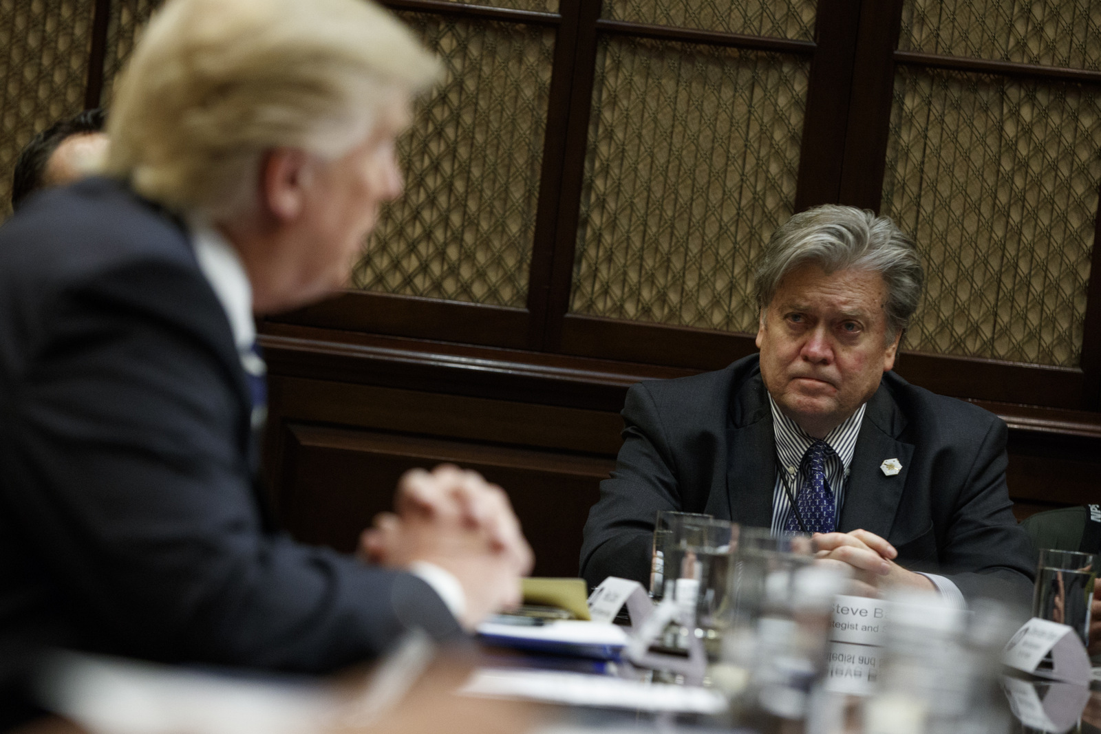 White House Chief Strategist Steve Bannon listens as President Donald Trump speaks in the Roosevelt Room of the White House in Washington, Tuesday, Jan. 31, 2017. (AP/Evan Vucci)