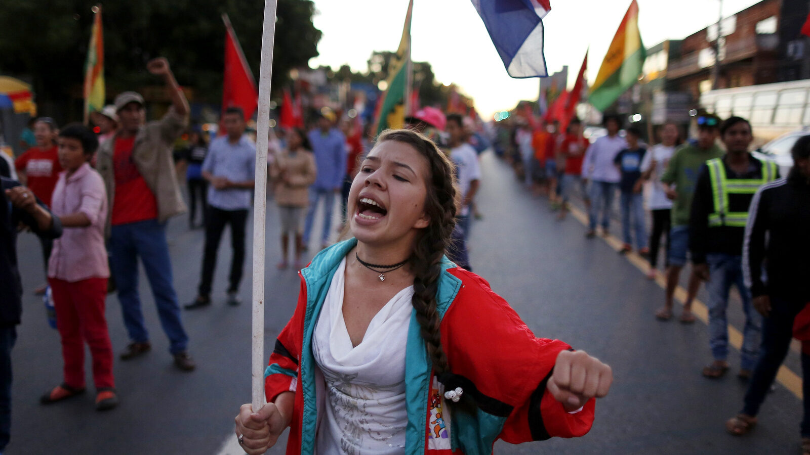 Paraguayans taking part in the “Long March” protest, a week-long walk from the interior to the capital, chant slogans against president Horacio Cartes, in Asuncion, Paraguay, Monday, Feb. 13, 2017. Organized by the Paraguay Pyahura Party or New Paraguay Party in Guarani, the walk is a protest against the government of Cartes who they say only protects the interest of landowners and soybean production, leaving aside the poor. The protesters are demanding access to health, education and housing, and the resignation of Cartes. (AP/Jorge Saenz)