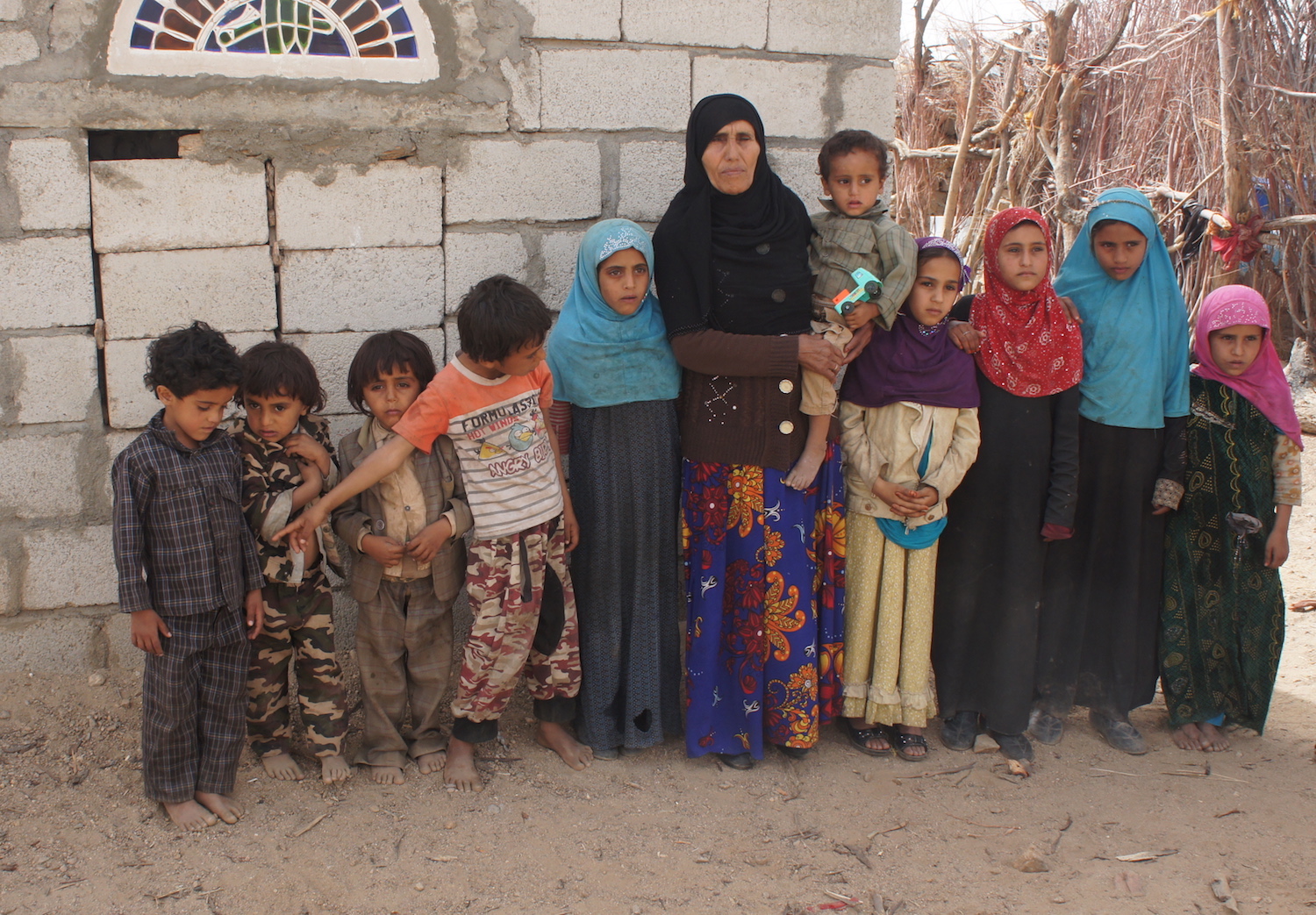 Relatives of those who died, including the seven children of Fatim Saleh Mohson al Ameri. (Photo: Nasser al Sane)