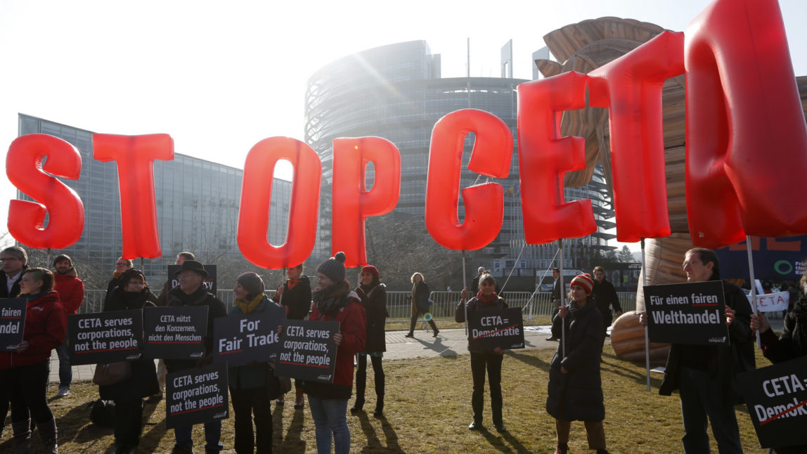 Activists stage a demonstration against the so-called CETA trade deal outside the European Parliament in Strasbourg, eastern France, Wednesday, Feb.15, 2017. (AP/Jean-Francois Badias)