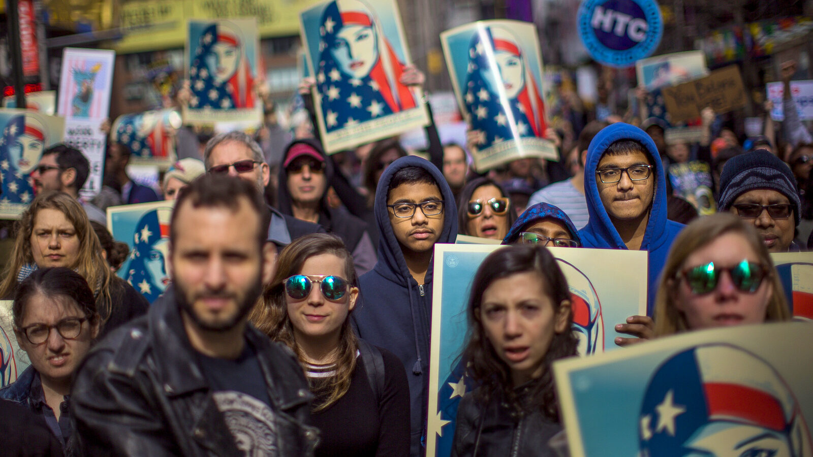 People carry posters during a rally in support of Muslim Americans and protest of President Donald Trump's immigration policies in Times Square, New York, Sunday, Feb. 19, 2017. (AP/Andres Kudacki)