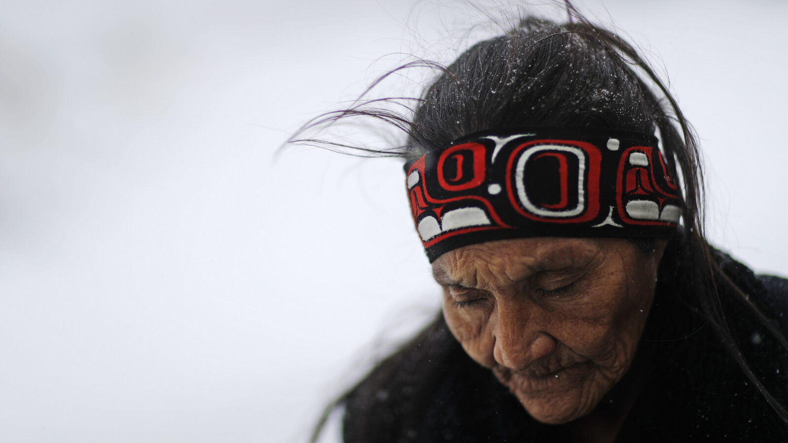 Grandma Redfeather of the Sioux Native American tribe walks in the snow to get water at the Oceti Sakowin camp where people have gathered to protest the Dakota Access oil pipeline in Cannon Ball, N.D. (AP/David Goldman)