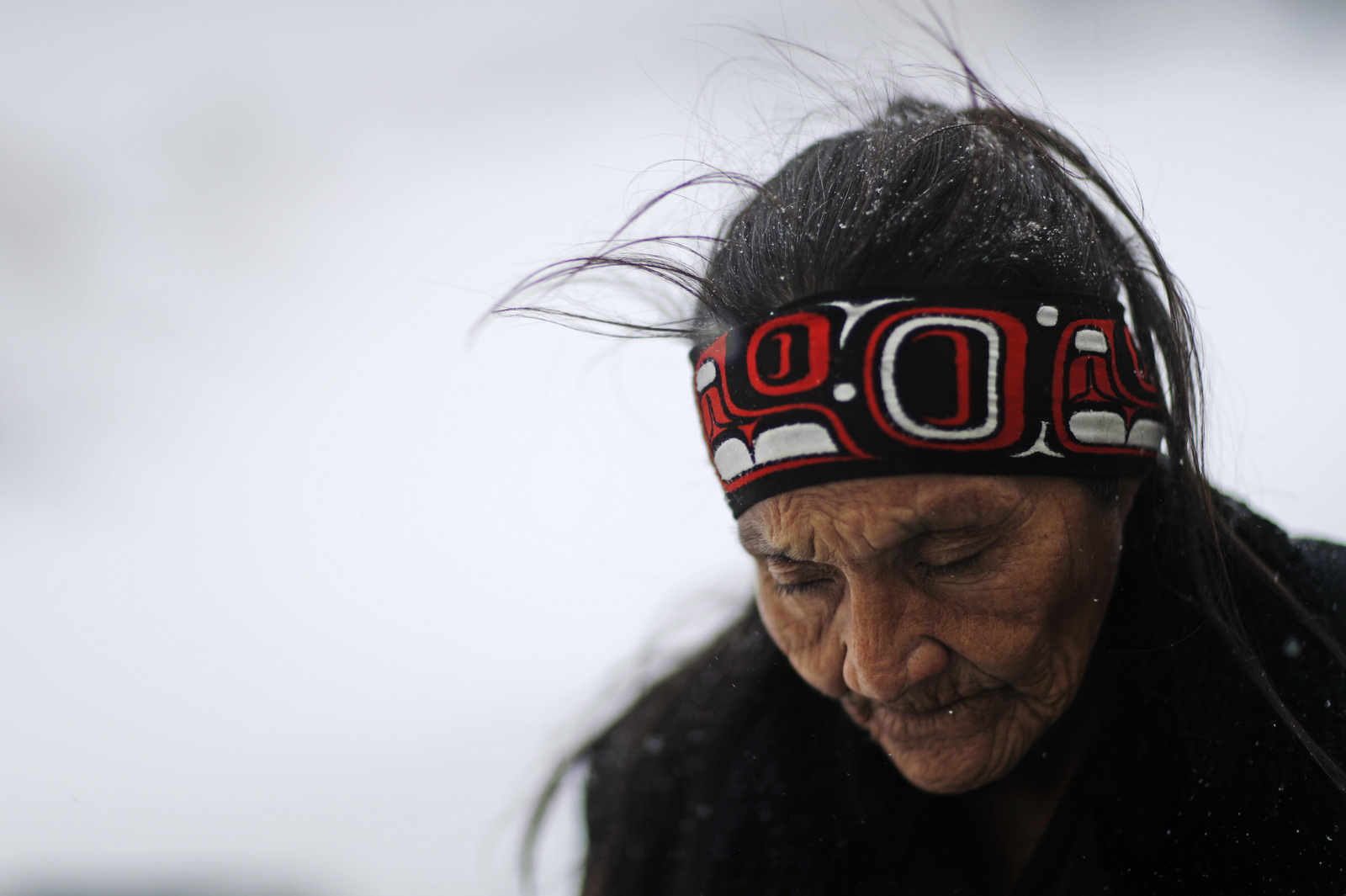 Grandma Redfeather of the Sioux Native American tribe walks in the snow to get water at the Oceti Sakowin camp where people have gathered to protest the Dakota Access oil pipeline in Cannon Ball, N.D. (AP/David Goldman)