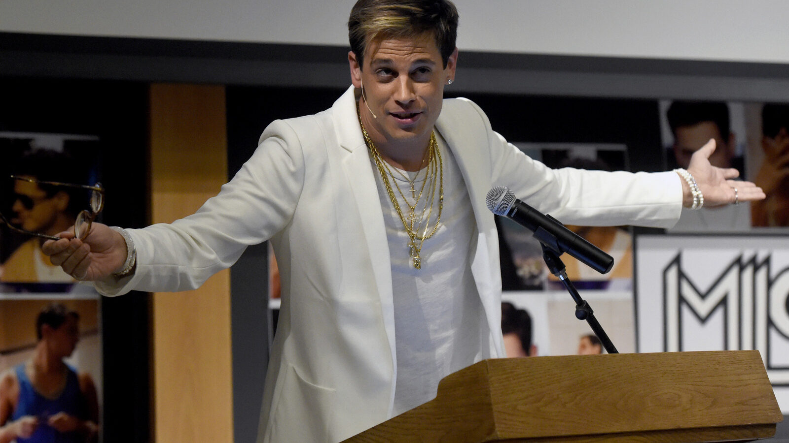 Milo Yiannopoulos speaks on campus in the Mathematics building at the University of Colorado in Boulder, Colo. Right-wing provocateur Yiannopoulos was trying to clarify past comments on relationships between boys and older men after a conservative site posted a collection of edited video clips that set social media abuzz. After the polarizing Breitbart News editor was invited this weekend to speak at the annual Conservative Political Action Conference sparked a backlash, the Reagan Battalion tweeted video clips Sunday, Feb. 19, 2017 in which Yiannopoulos discusses Jews, sexual consent, statutory rape, child abuse and homosexuality. (Jeremy Papasso/Daily Camera via AP, File)