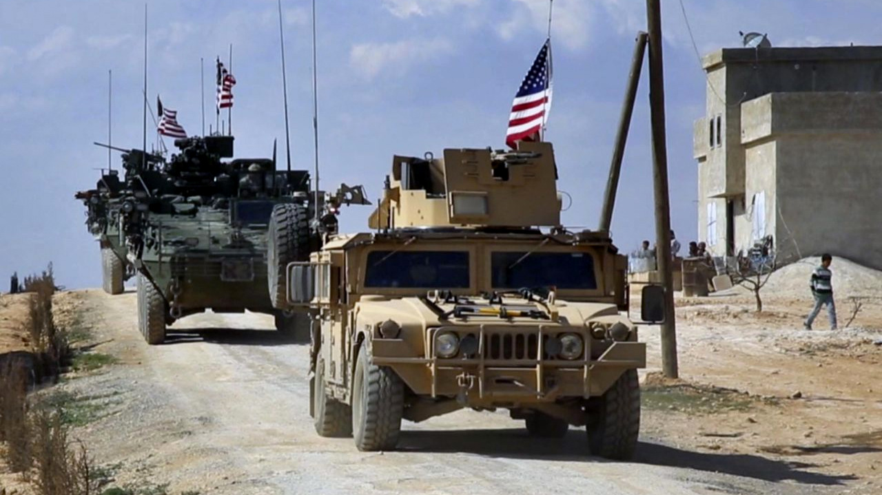 U.S. forces patrol on the outskirts of the Syrian town, Manbij, a flashpoint between Turkish troops and allied Syrian fighters and U.S.-backed Kurdish fighters, in al-Asaliyah village, Aleppo province, Syria, March 7, 2017. (Arab 24 via AP)