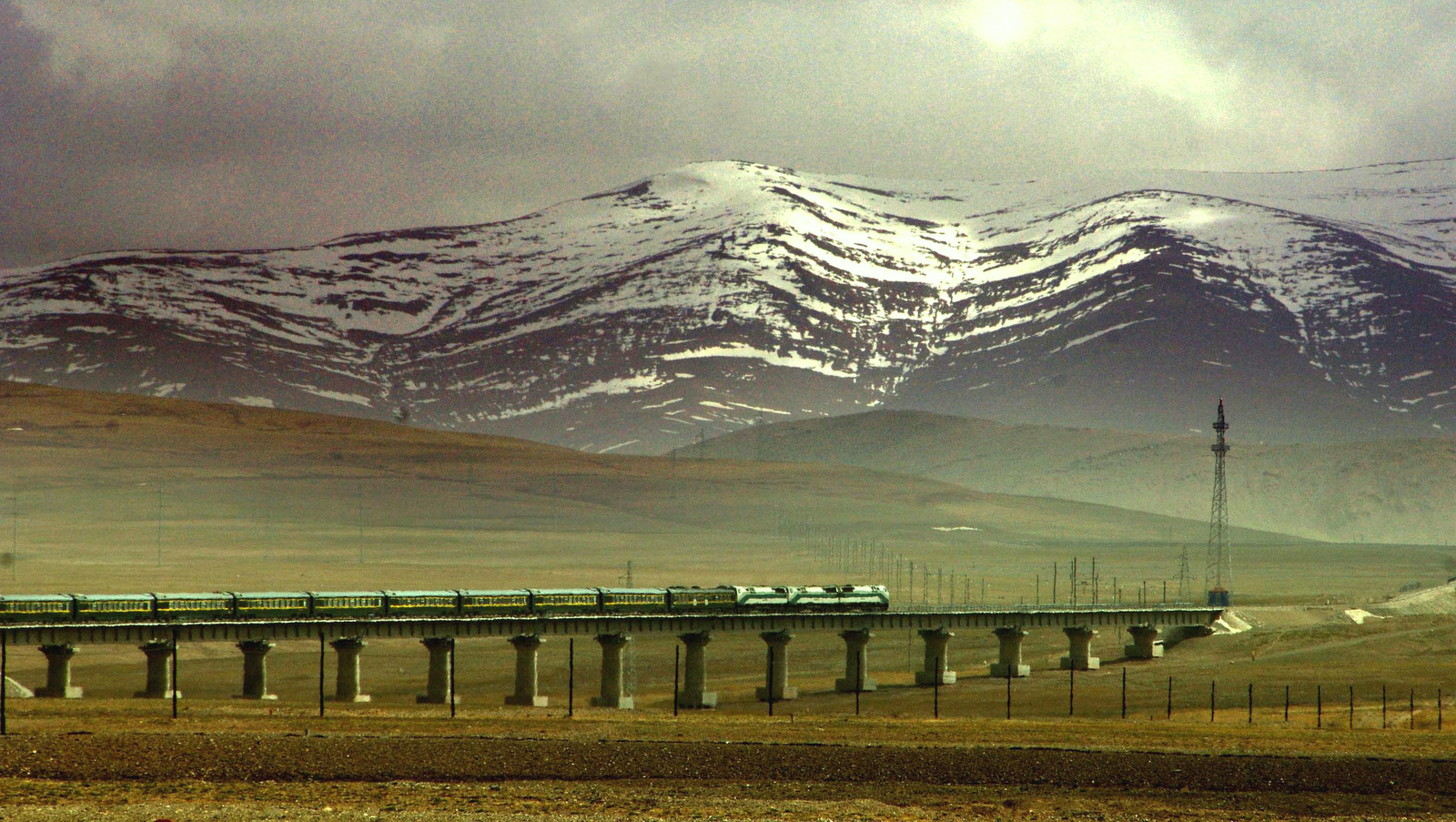 A train runs along the Qinghai-Tibet Railway in the section of Golmud, northwest China's Qinghai Province. (AP/ Xinhua, Chen Xie)