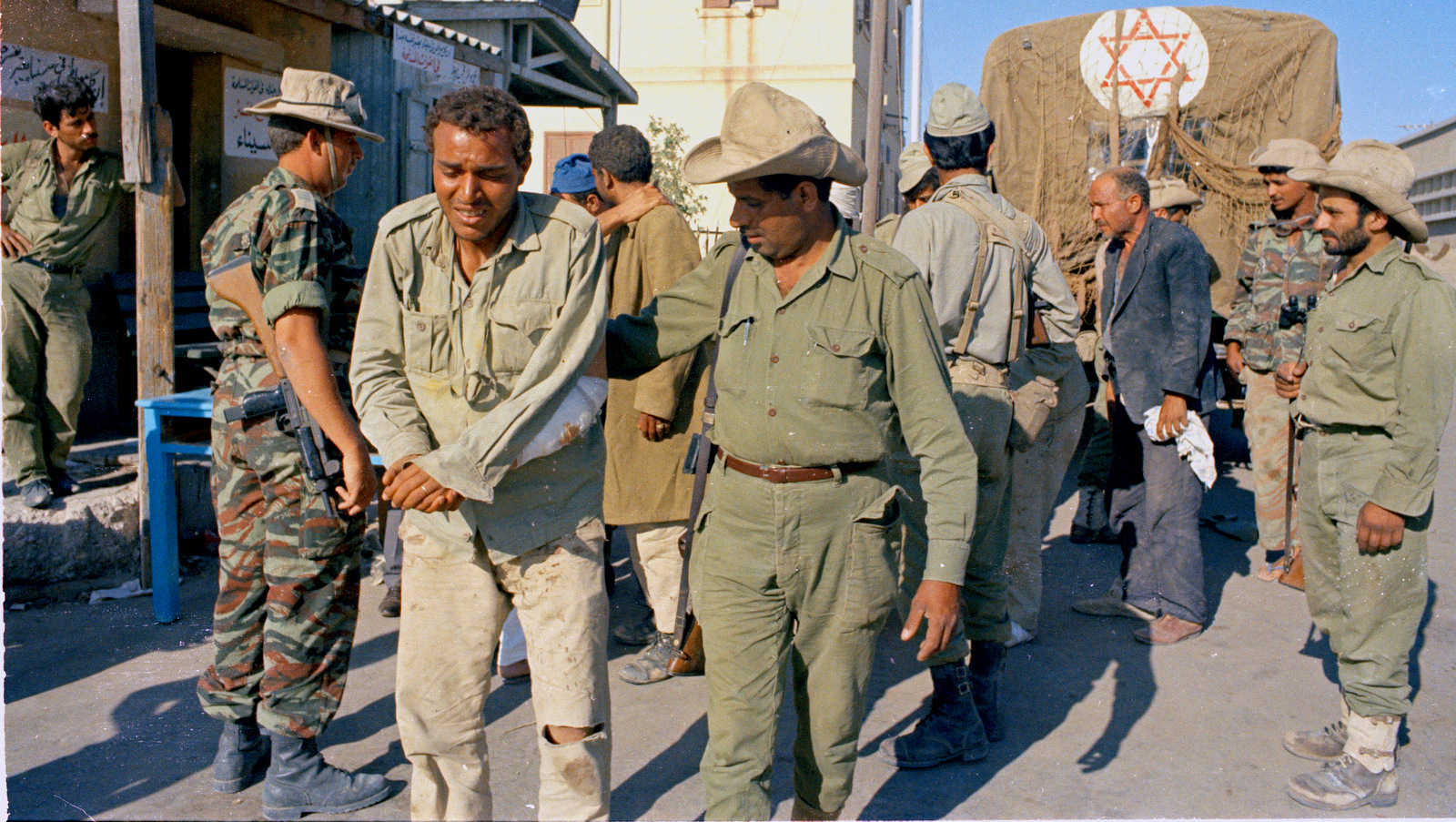 An Israeli soldier is seen with an Arab prisoner, June 1967. (AP Photo)