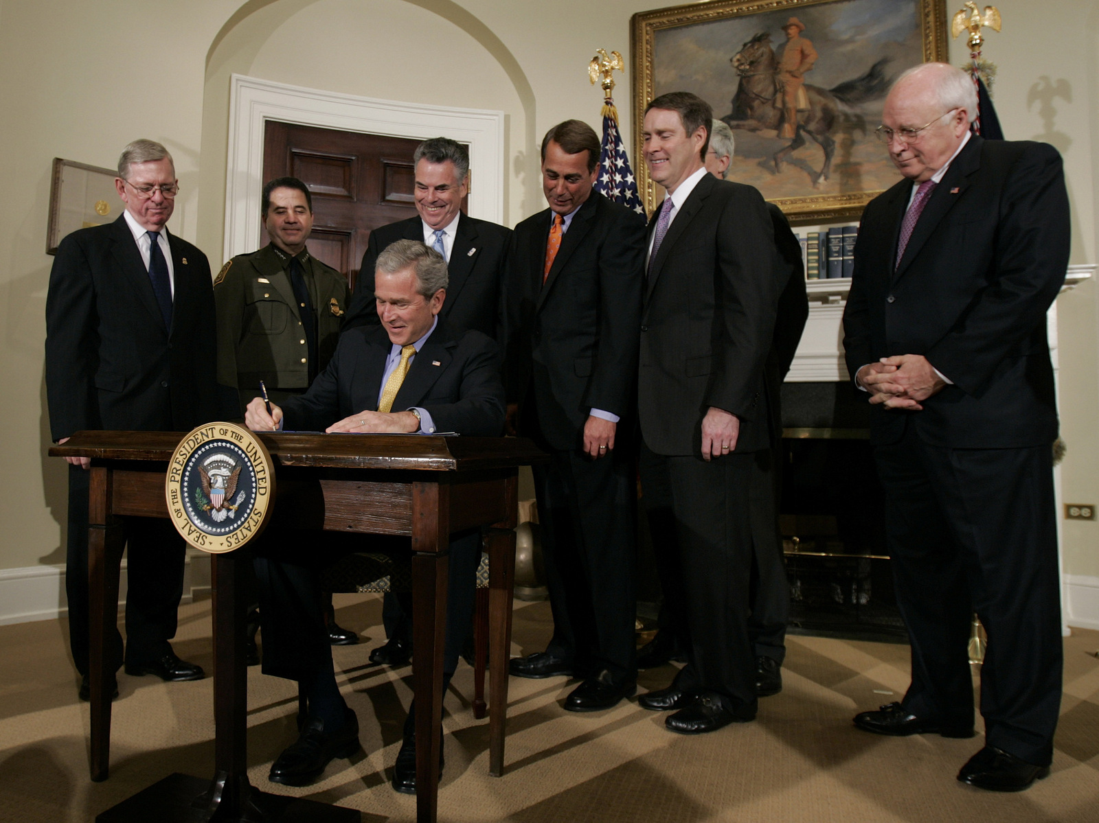 President Bush signs the Secure Fence Act of 2006 in the Roosevelt Room at the White House in Washington, Oct. 26, 2006. (AP/Ron Edmonds)